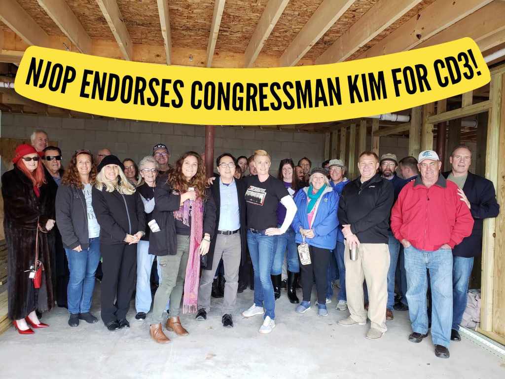 (a our members & Congressman Kim on the Sandy Anniversary in 2018 in an unfinished Sandy house) Text reads: NJOP ENDORSES CONGRESSMAN KIM FOR CD3!