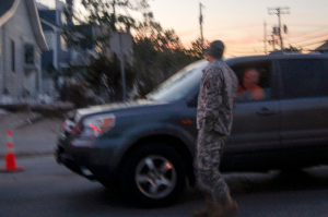 A National Guardsman checking people’s IDs to see if they lived in town or had clearance to enter at the northern edge of Bay Head, NJ along Rt. 35 on Nov. 15, 2012